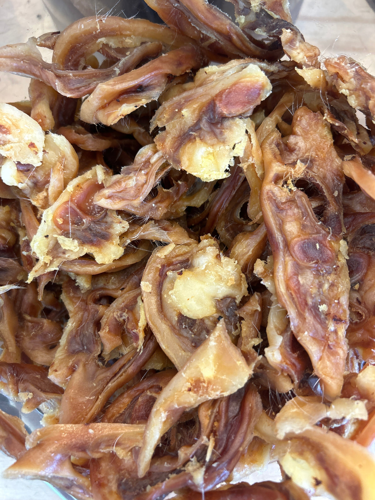 Bark Road Bacon Scrolls dog treats showing the size and texture of the pieces